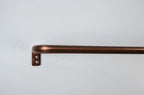 A bronze-finished metal wall bar with a square mounting bracket, shown against a plain white background.